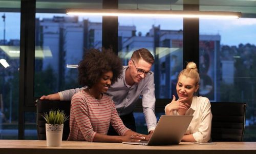multiethnic-startup-business-team-in-night-office-photo